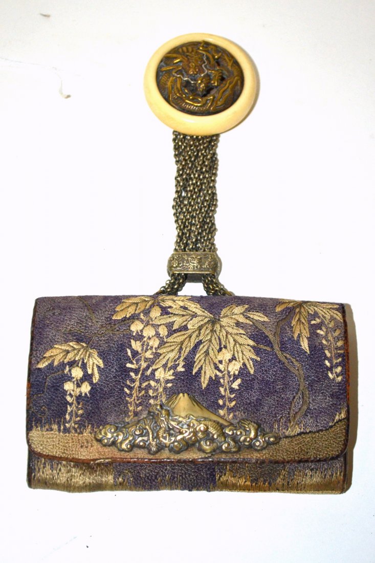 Japanese Meji Brocade Tobacco Pouch: Purple and silver-color thread brocade with leafy floral frond decor. Bears silver-tone fitting with dragon against Mt. Fuji. Ojime contains 12 chains connected to a faux ivory netsuke with silver and