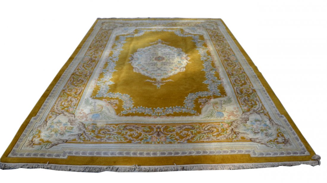 Palace Size Aubusson Style Rug: Features pastel scrolling tendrils, leafy flower blossoms, and large center medallion, all against an amber color background. Light soiling and one repair on backing near corner. [18" x 26"]