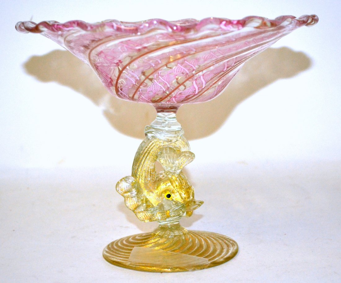 Venetian Glass Compote: Pink and gilt decorated glass compote, with dolphin form base. 7" x 9".