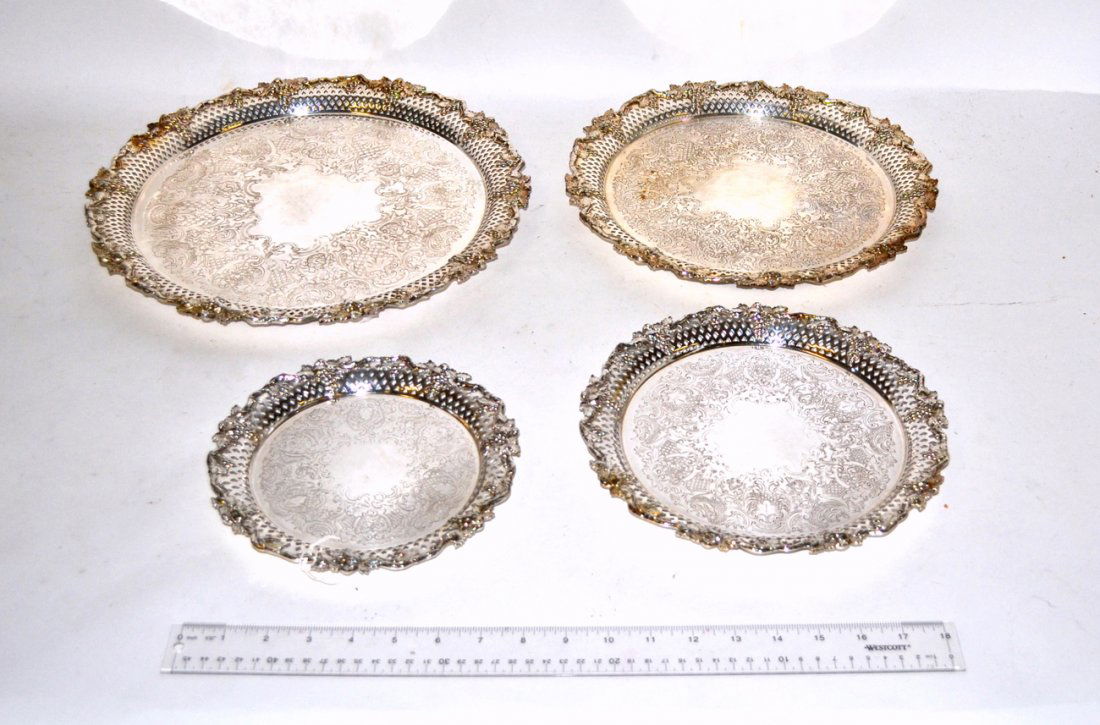 Four Silverplated Trays: Four graduated size trays, reticulated with leaf and grape decor.
