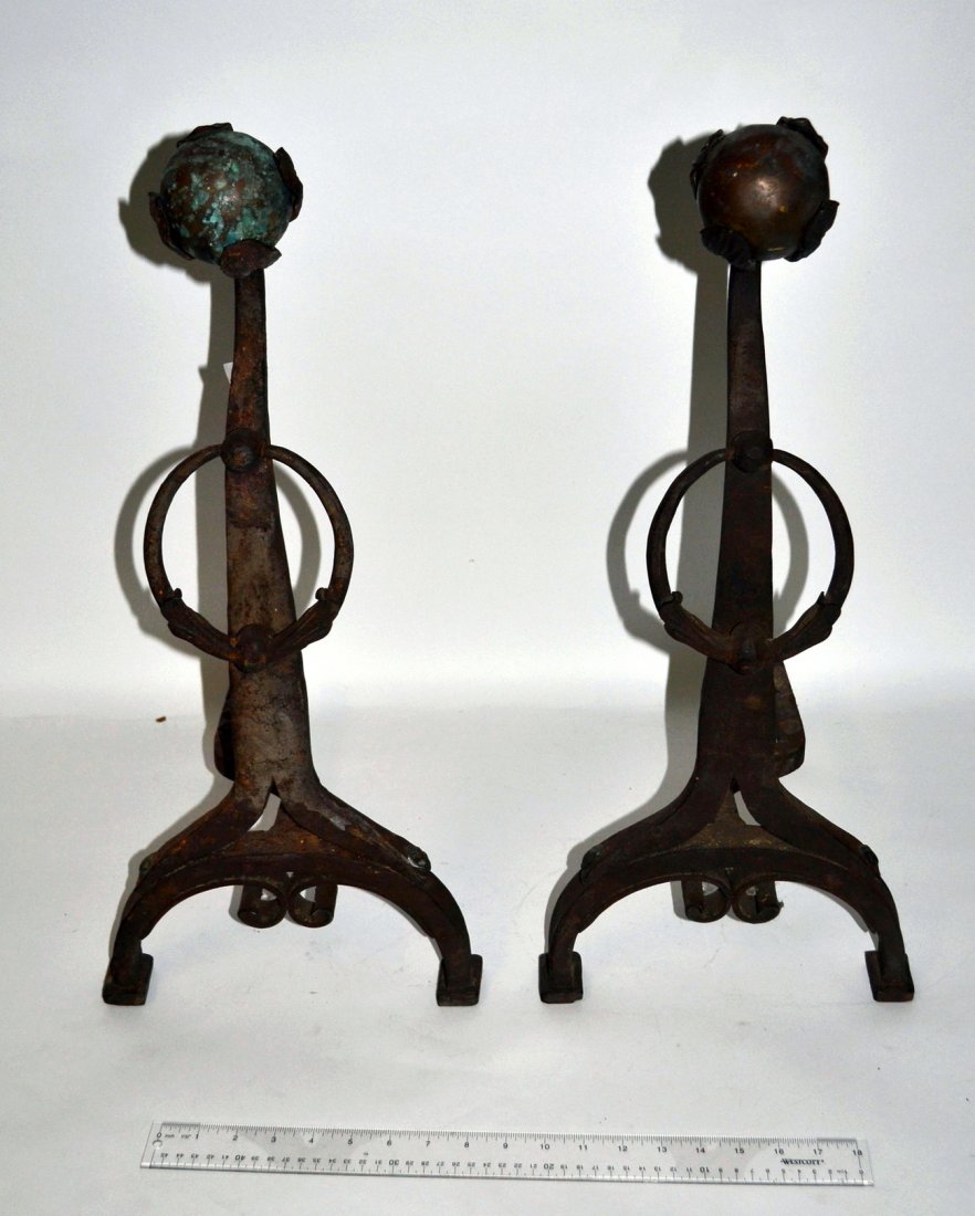 Pair of Arts & Crafts Andirons: Pair of floral and ball design andirons. [24" H x 12" D]