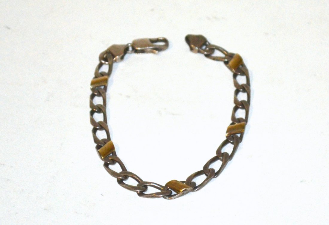Tiffany & Co. Sterling Bracelet: Chain link bracelet with vermeil accents. Stamped on clasps "Tiffany & Co." and ".925 Italy". 7 1/2 " long end to end. .35 ozt..