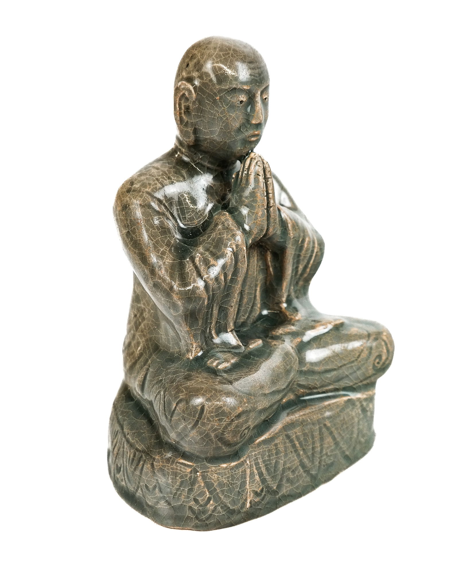 Korean Joseon Period Celadon Buddha: Korean celadon Buddha, Joseon Period, 18th century, seated and in anjali mudra, with a lotus decorated base. [8" H x 5.5" W x 5" D]. Condition is good with heavy age-commensurate crazing.