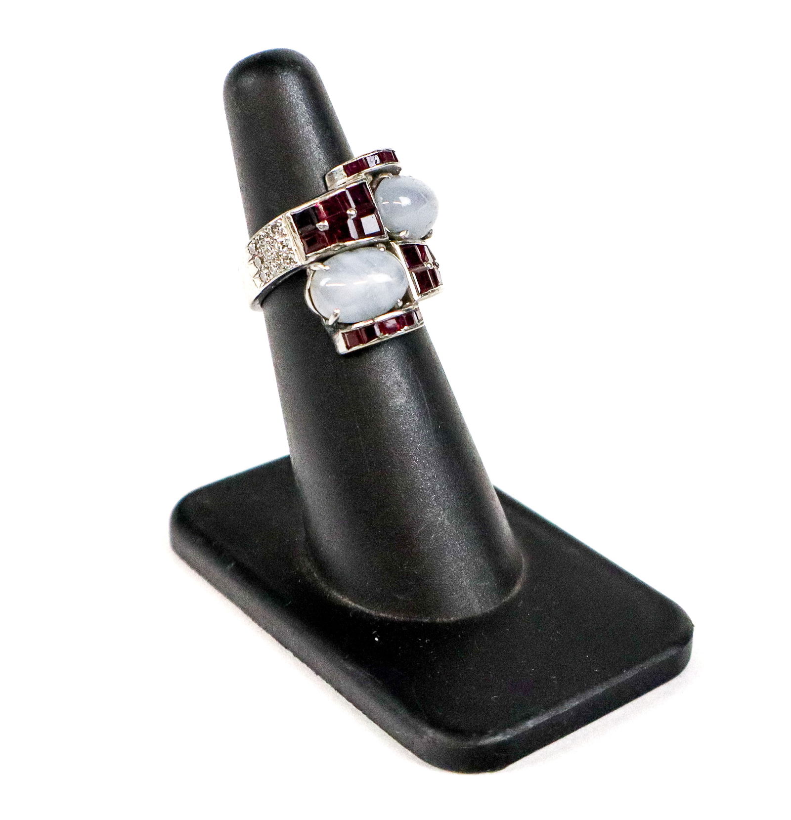 Art Deco Star Sapphire, Ruby and Diamond Ring: Art deco blue star sapphire, ruby and diamond passerby ring, containing two pale blue star sapphires, 21 caliber-cut rubies, and 18 full-cut diamonds, unmarked, tests for platinum. [8.89 dwt., size