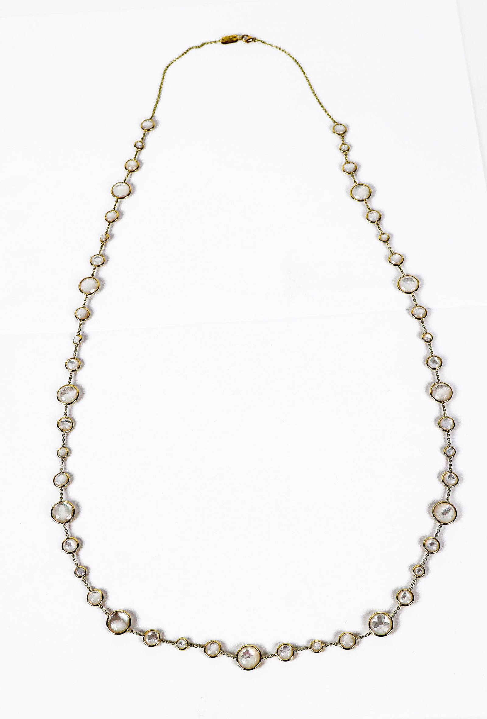 Ippolita Mother-of-Pearl & Gold"Lollitini"Necklace: Ipopolita faceted mother-of-pearl collet-set and18K gold "Lollitini " chain / necklace, mark to tag. [16.87 dwt., 34" L].l Overall condition is good.