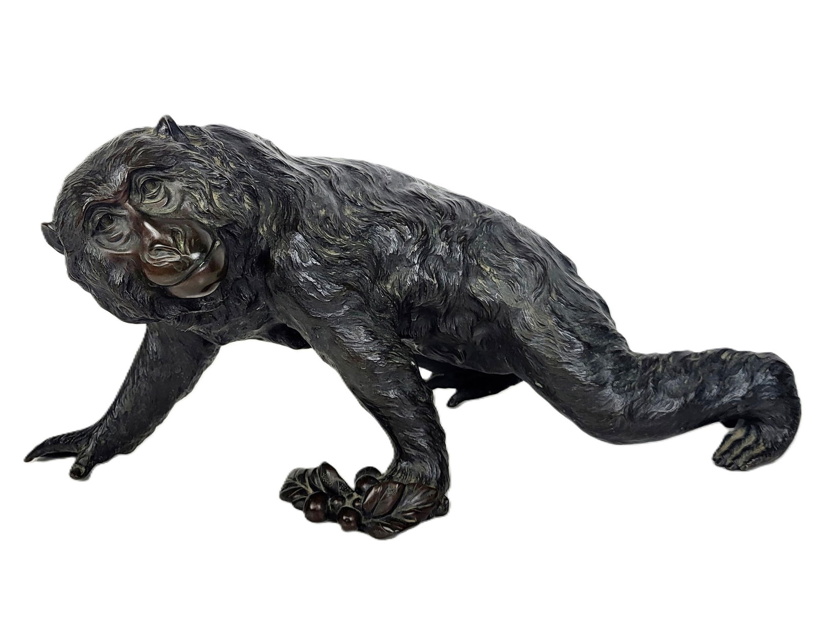 Japanese Bronze Monkey: Japanese Bronze Monkey, 19th Century, the monkey in a crawling pose with flowering fruit in left hand, finely detailed all over fur and underhands, signed under belly. [9.5" H x 21" L x 9.5" D]. Very