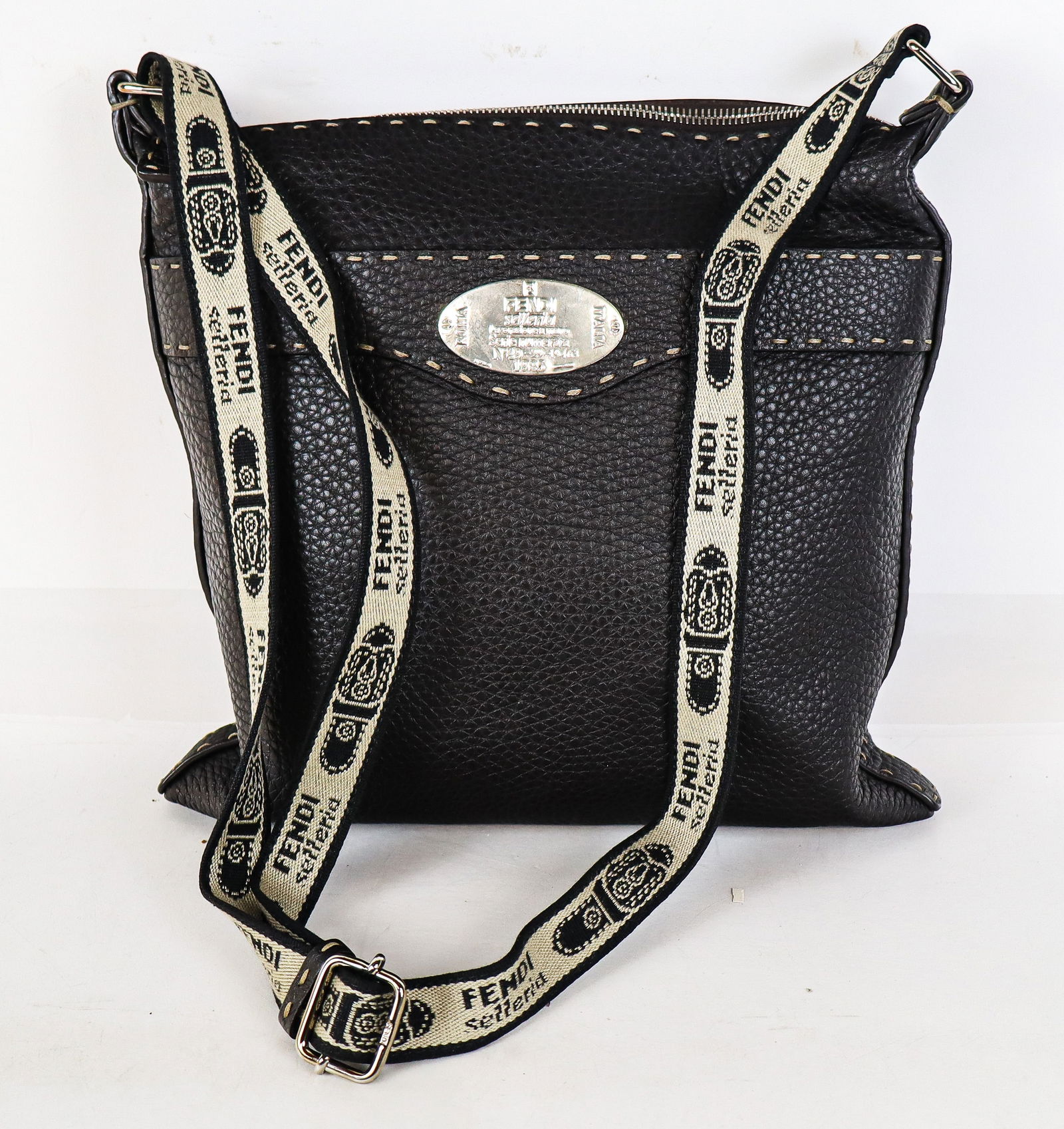 Fendi Selleria Shoulder Bag Brown Leather: Fendi Selleria Shoulder Bag Brown Leather, Analine tanned leather with pronounced stitching and Fendi stitched shoulder strap, outside buttoned pocket and inside zippered pocket, Sterling silver