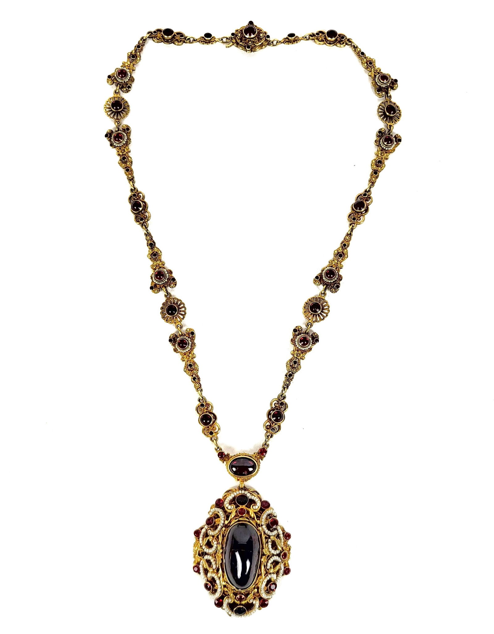 Austro-Hungarian Gilt Silver & Garnet Necklace: Austro-Hungarian gilt .800 quality silver, garnet and seed pearl necklace, Budapest, 1872-1922, assay and maker's mark KE on clasp. [20.5" Length]. Overall condition is good/fair, central garnet