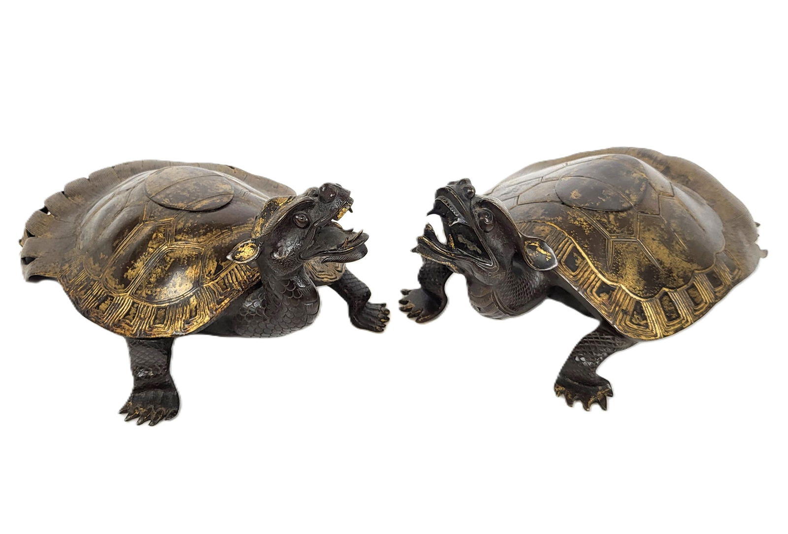Pair of Japanese Bronze Minogame Turtle Censers: Pair of Japanese bronze Minogame turtle censers, partially gilt bronze tops, with the faces being of angered growling turtles showing mouths open and teeth and tongue exposed, scaled and sharp talon f