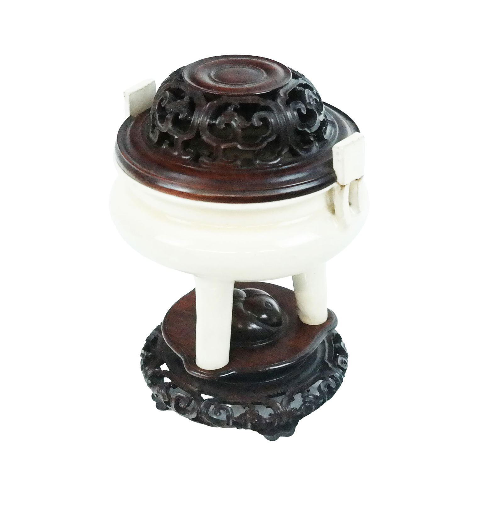 Chinese White Glazed Porcelain Censer on Stand: Chinese white glazed porcelain tripod censer on stand, the censor in archaic form with two handles, very detail carved wood and pierced cover, and fitted stand. [6.5" H x 5" Diameter]. One handle brok