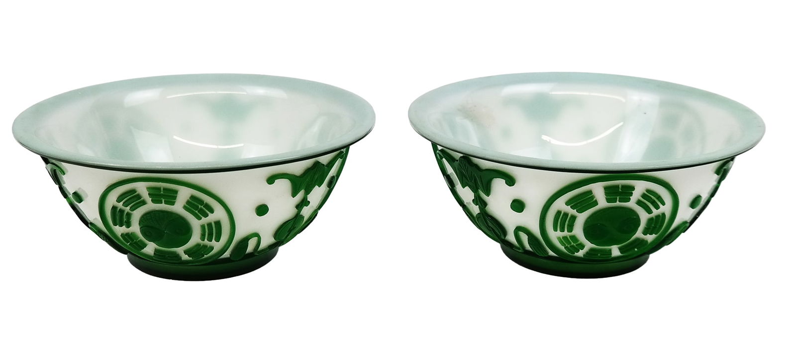 Pair of Vintage Green on White Peking Glass Bowls: Pair of Vintage green on white Peking Glass bowls, decorated with trigram and bats, raised ring bases. [2.5" H x 6.25" Diameter]. Very good condition.