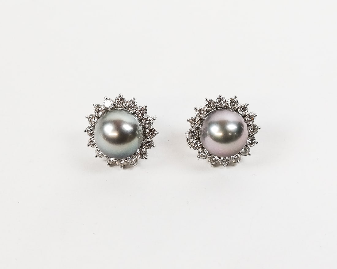 Pair of Cultured Pearl and Diamond Earrings: Pair of silver cultured pearl, diamond and 18K white gold earrings, designed as clusters, the 12.5mm silver pearls enclosed by borders set with 32 round brilliant-cut diamonds, total approximately 3.2