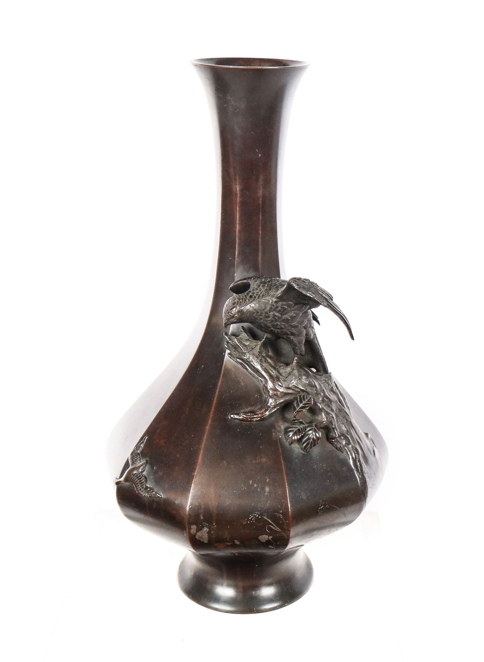 Japanese Meiji Bronze Vase: Japanese Meiji Bronze Vase with raised eagle on branch, silver and copper eyes and floral design around mid body, signed with seal on bottom. [19.5" H x 10" diameter]. Solid, but with very minor dents