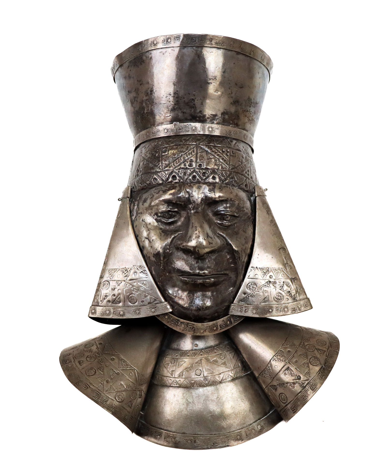 Silver Incised Reliquary Bust: Silver incised reliquary bust, the face and immediate crown with design are one piece of silver, the back of the head another piece, then with hammered additions all over to present the bust in a rega
