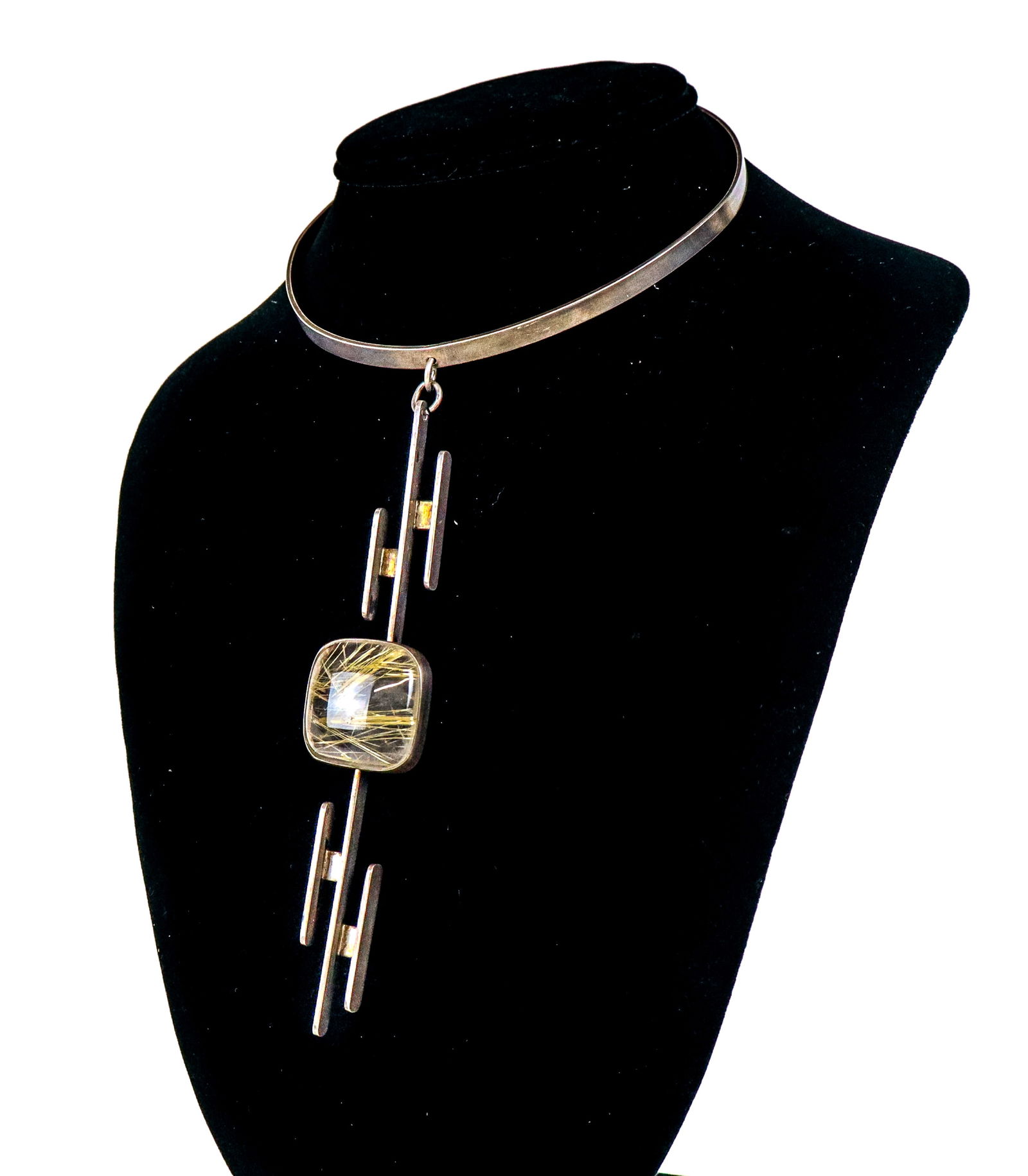 Minimalist Sterling & Rutilated Quartz Necklace: Minimalist sterling silver and rutilated quartz pendant necklace, circa 1970, school of Vivianna Torun Bulow-Hube, designed as a silver choker suspending an elongated pendant centered by a collect set