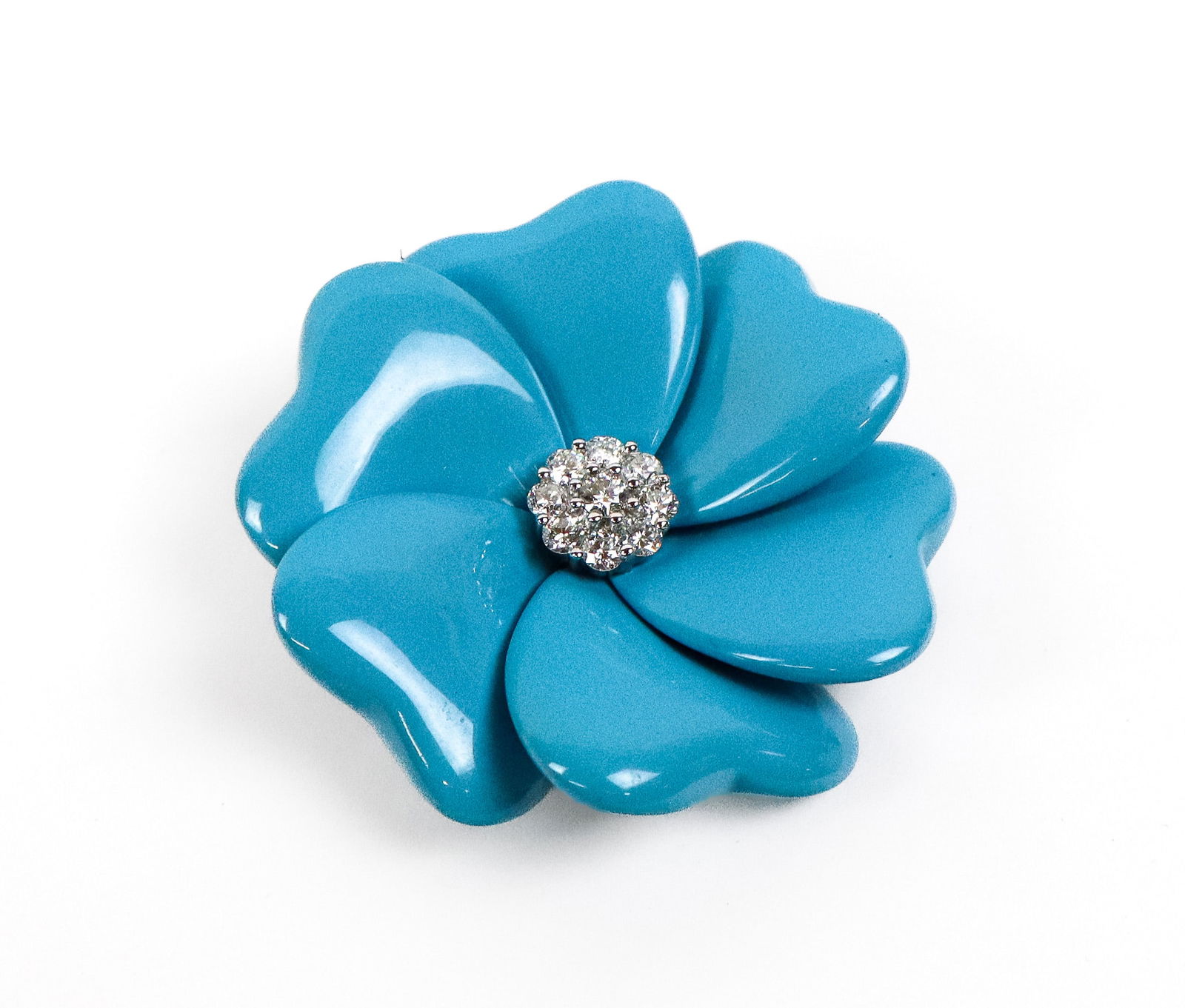 Turquoise and Diamond Flower Brooch: Turquoise, diamond and 18K white gold flower brooch, set with 9 round brilliant-cut diamonds, total 1.00 carat, signed on the reverse 750 18K D 1.00 carat 11540. [25.14 dwt., 2" Diameter]. Overall