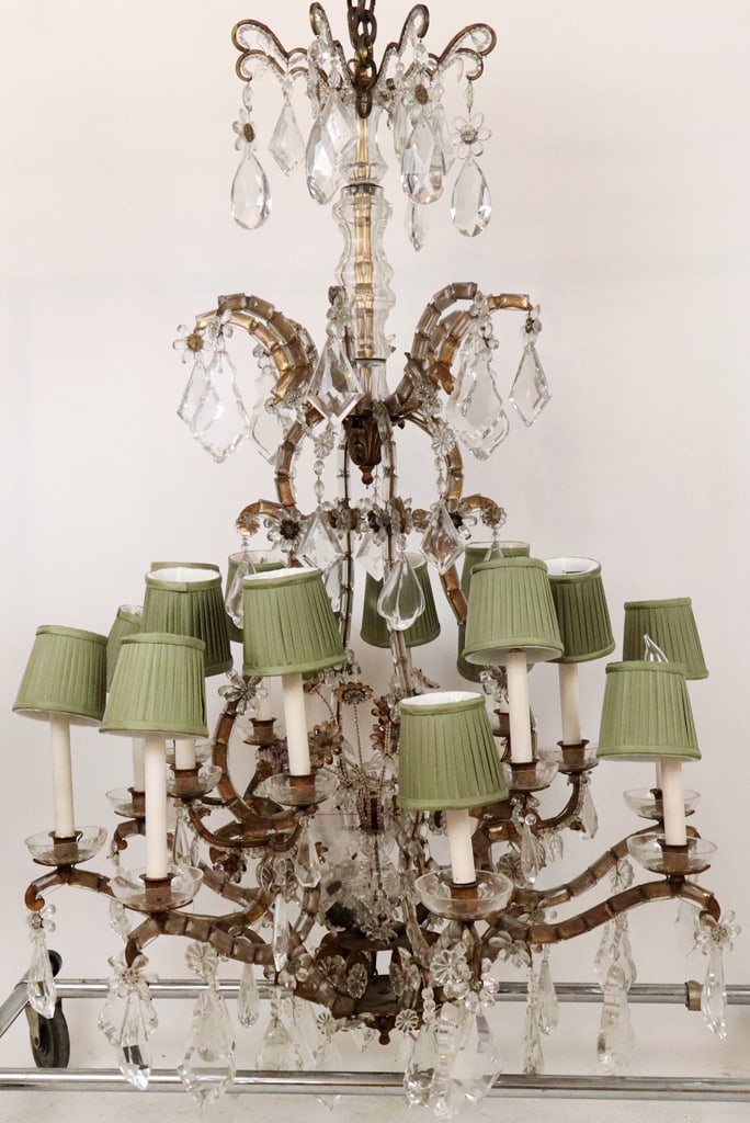 Louis XV Gilt & Crystal 16 Light Chandelier: Palatial Louis XV etched and cut crystal 16-light chandelier, 20th century, set in a gilt frame, with floral accents to frame and crystal flower decoration to lower, with 16 arms terminating in lights