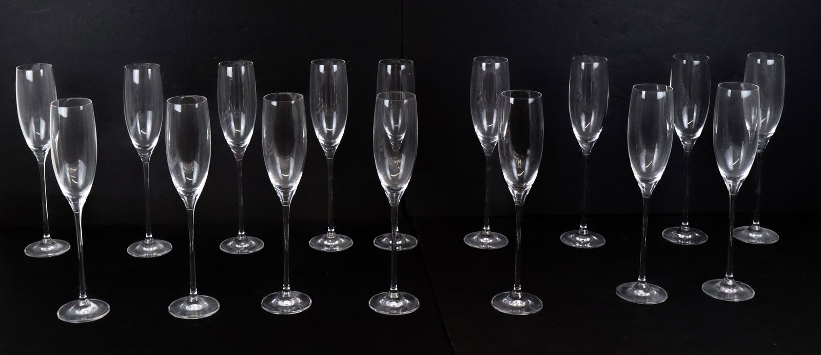 Oleg Cassini Set of Crystal Champagne Flutes, 15: Set of Oleg Cassini crystal 6 oz. champagne flutes, marks to base. [11" H x 2.5" Diameter]. Overall condition is good.