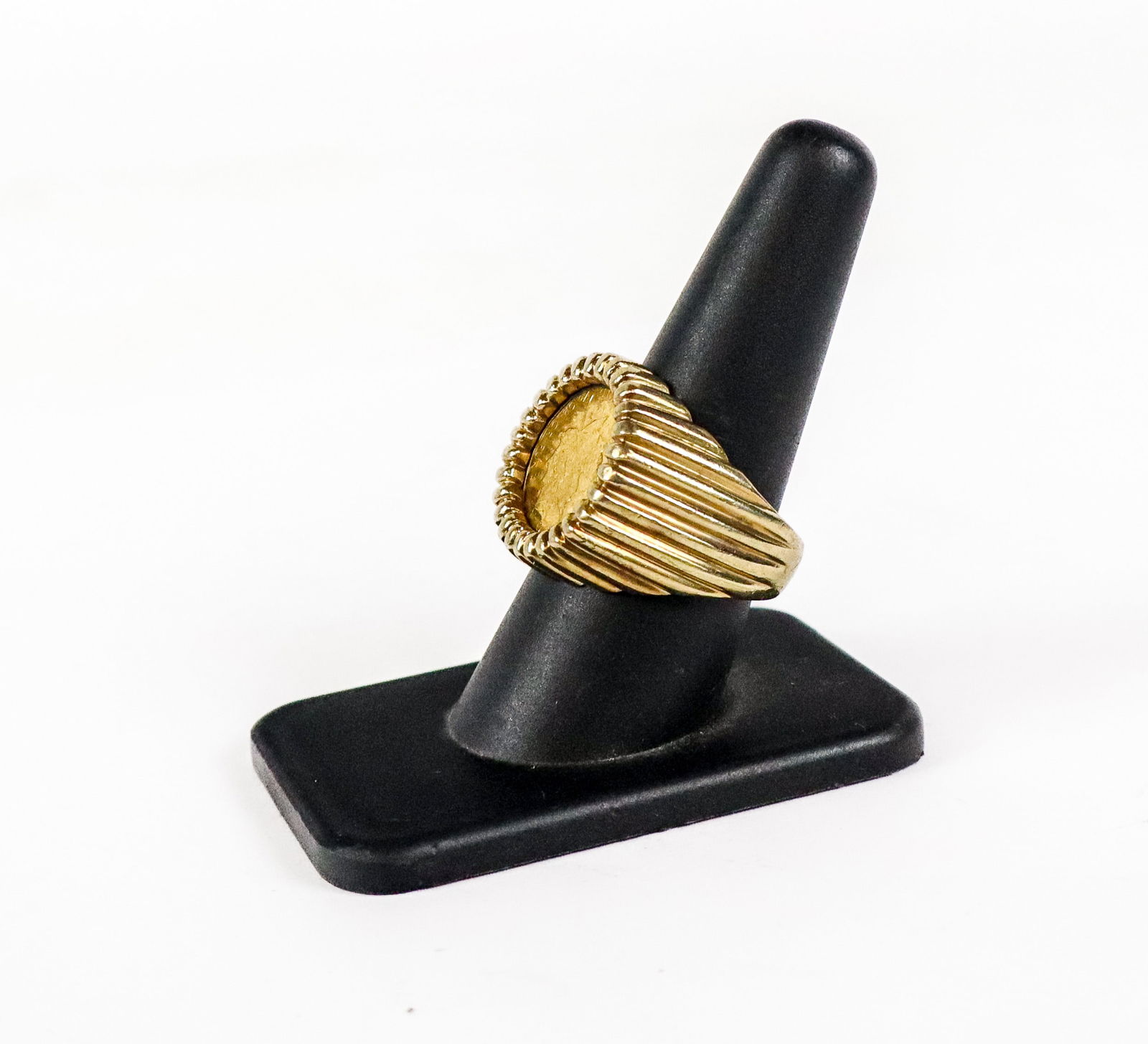 Gold and Gold Coin Ring: 14K gold and Canadian gold Maple Leaf 1/10 oz. coin, marked 14K. [11.32 dwt., Ring size: 9]. Overall condition is good/fair, shank out of round, minor loss to coin due to mounting.