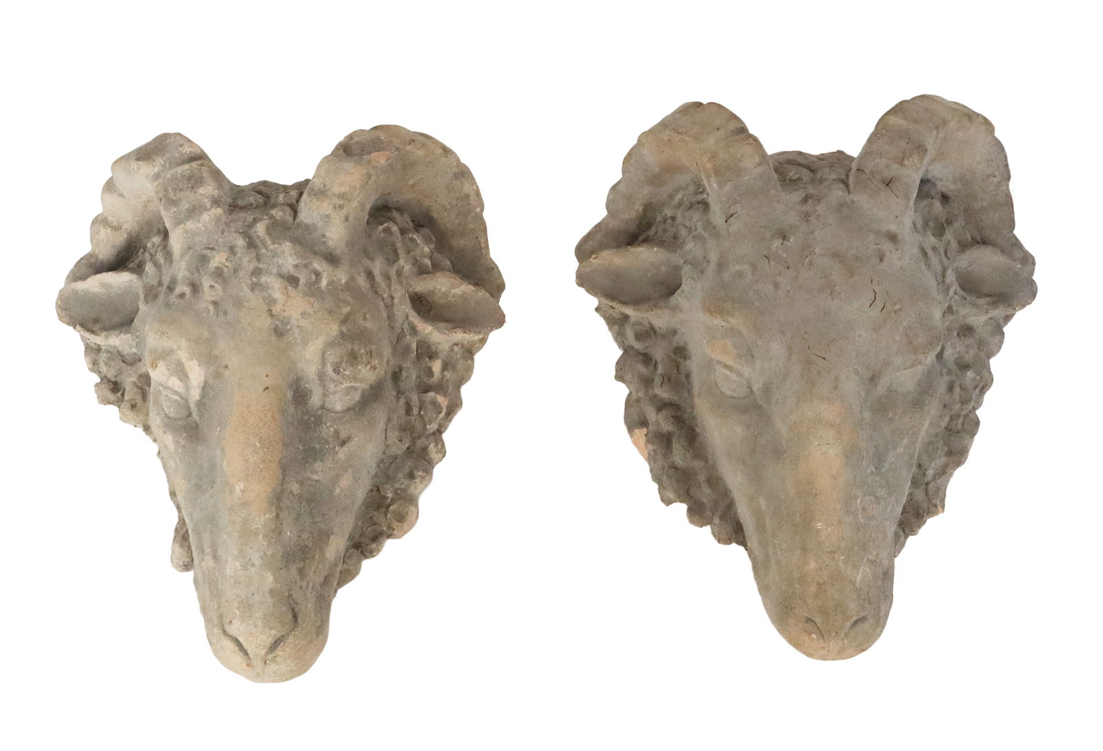 Pair of Terra Cotta Ram's Head Appliques: Pair of terra cotta ram's head appliques, Italy, 19th century, with later mounted with wires to reverse. [15" H x 13" W x 6.5" D]. Condition is good with wear, and heavy losses to side of one.