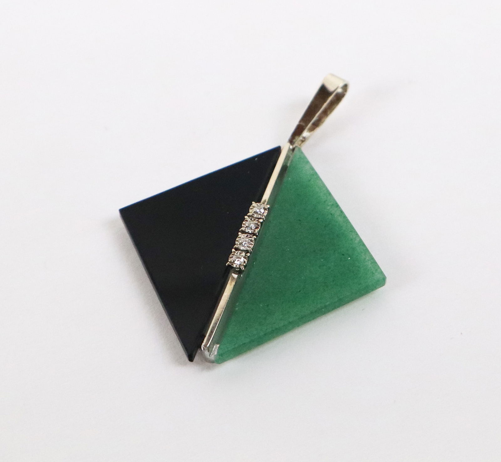 Art Deco Inspired Adventurine, Diamond and Plastic: Art deco inspired aventurine, diamond and faux onyx kite-shaped pendant mounted in 14K white gold, marked. [4.34 dwt., 1.5" Square]. Overall condition is good.