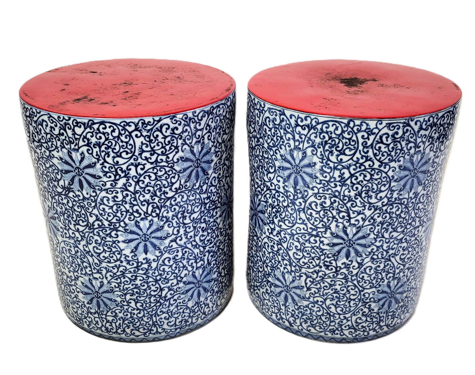 Gump's Chinese Porcelain Garden Seats, Pair: Pair of Chinese porcelain garden seats, 20th century, with blue and white decoration to sides and red seats, marked Gump's to base of each". [18" H x 15" diameter]. Good overall condition.