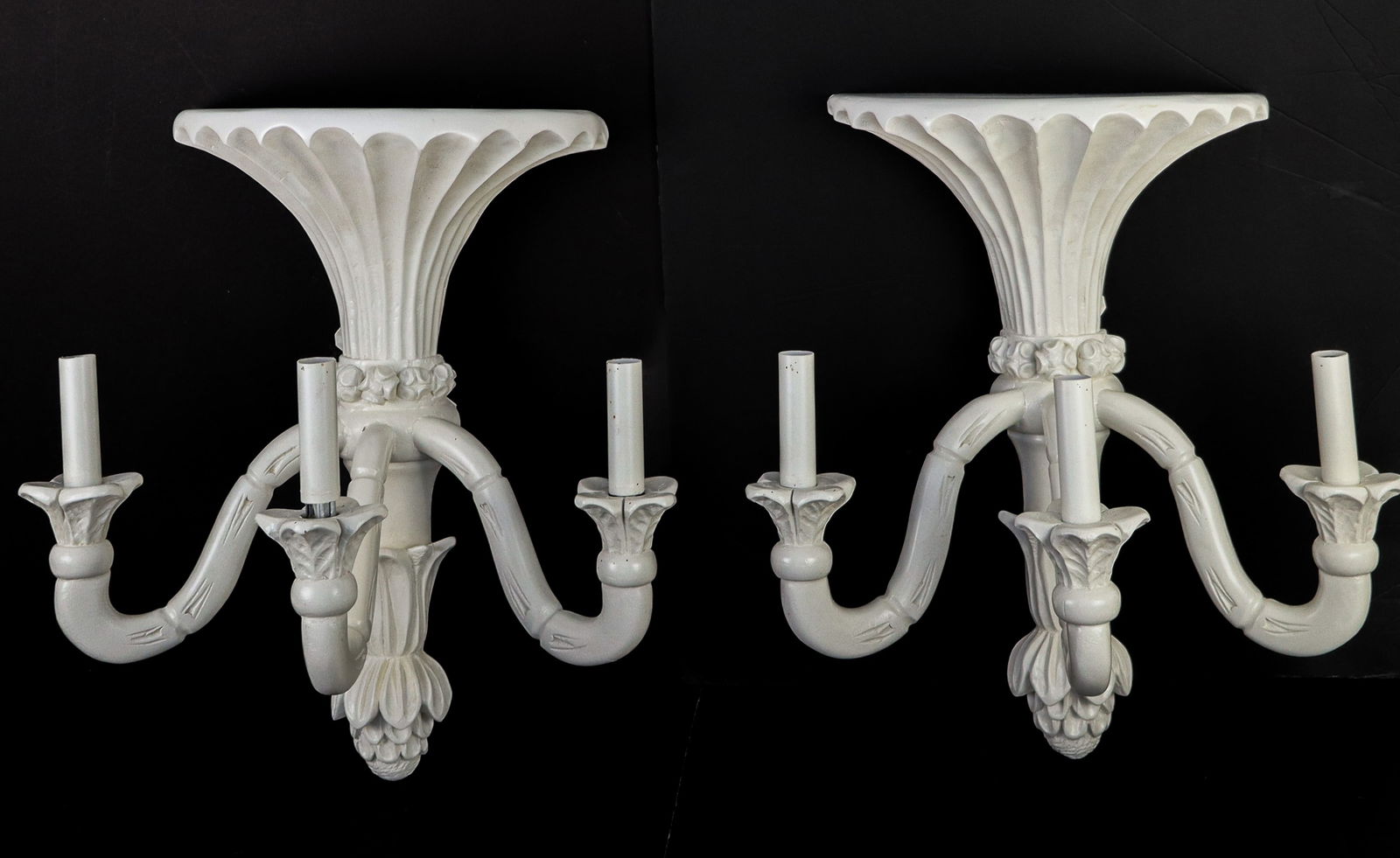 Pair of Chinoiserie Bracket Sconces: Pair of Chinoiserie bracket sconces, each having three faux bamboo arms below a flared fluted bracket top, all in white painted wood. Electrified. [18" H x 16" W x 10" D]. Very good condition