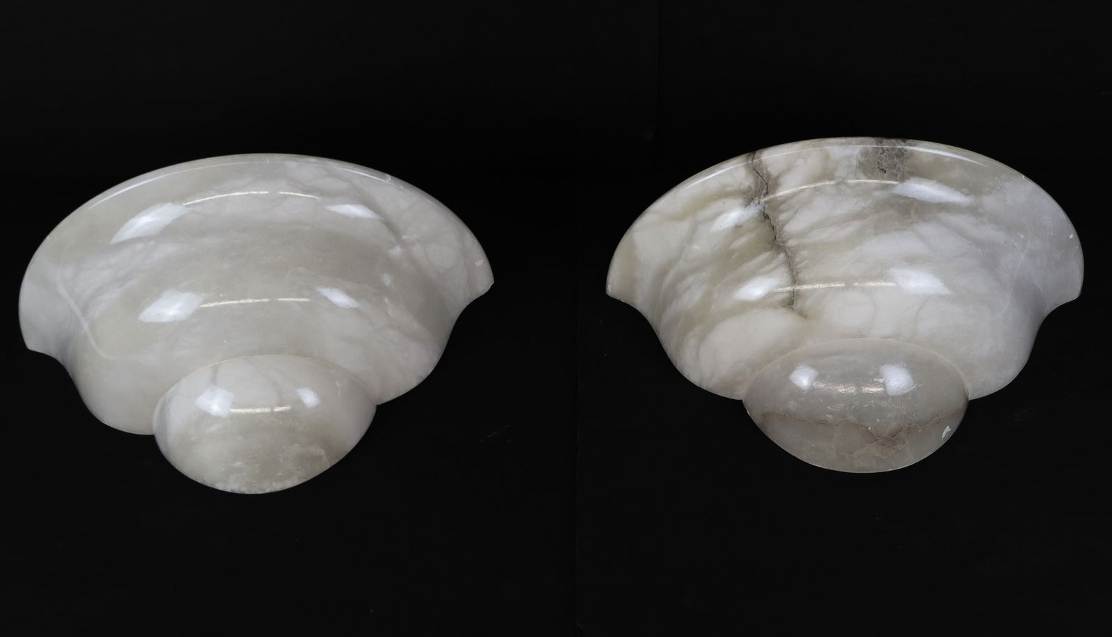 Pair of Carved Alabaster Sconces: Pair of carved alabaster sconces, Spanish, 20th century, produced by Sarreal Art i Llum, S.A., with labels to reverse. [7.5" H x 15" W x 7.5" D]. Condition to each is good, wiring untested.