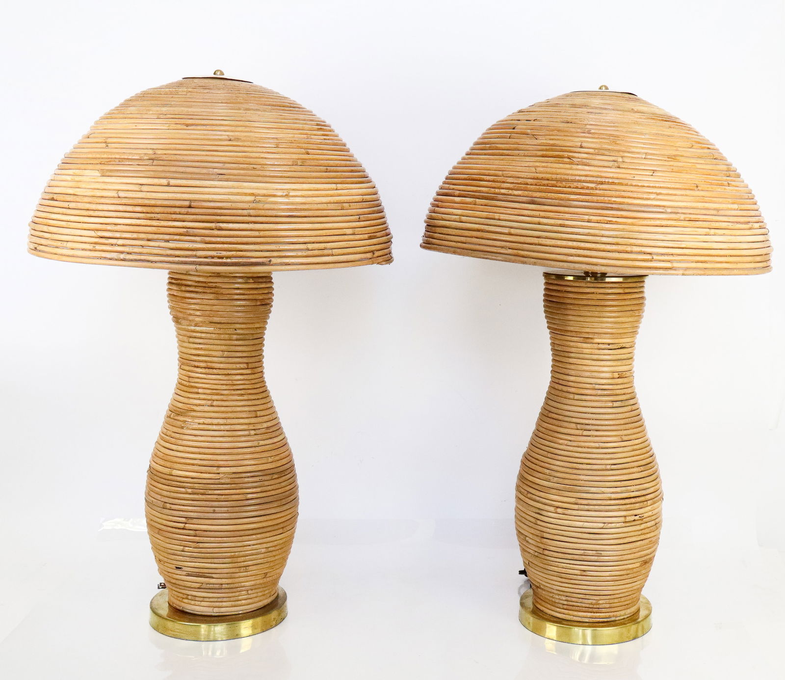 Pair of Mid Century Bamboo & Brass Table Lamps: Pair of contemporary bamboo mushroom-form table lamps with brass bases, Italian, 1960s.- 70's. [Overall with shades: 31" H x 20" Diameter]. Very good condition, no issues seen.
