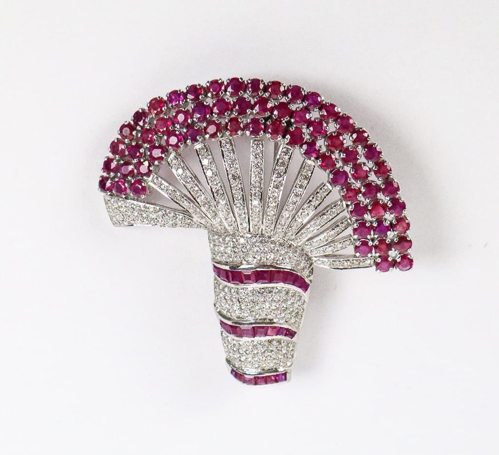 Ruby, Diamond and Gold Clip: Ruby, diamond and 18K white gold hat brooch, unmarked but tests for 18K gold. [16.71 dwt., 2.5" Square]. Overall condition is good.