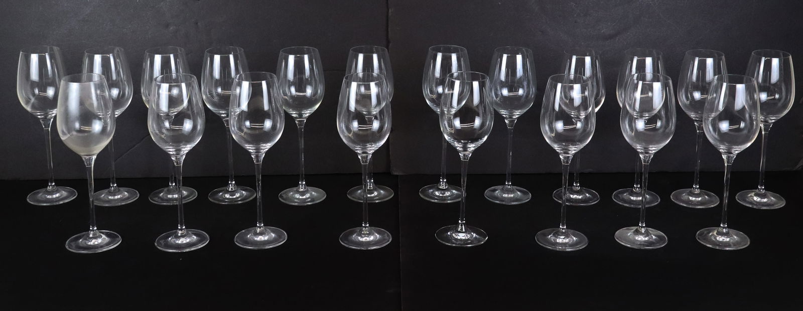 20 Oleg Cassini Crystal Goblets: 20 Oleg Cassini crystal goblets, all signed. [9.25" H x 3" Diameter]. Condition is good, some with minor residue.