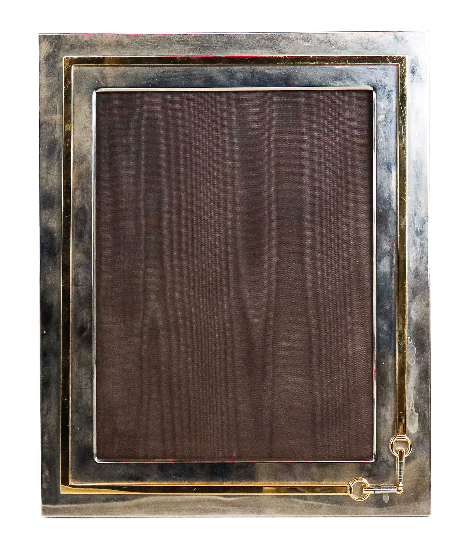 Gucci Vintage Picture Frame: Vintage picture from Gucci, Italian, late 20th century, with horse bit detail to lower right in brass, set on a silver tone frame, with double G to hardware at reverse, and marked Gucci made in Italy