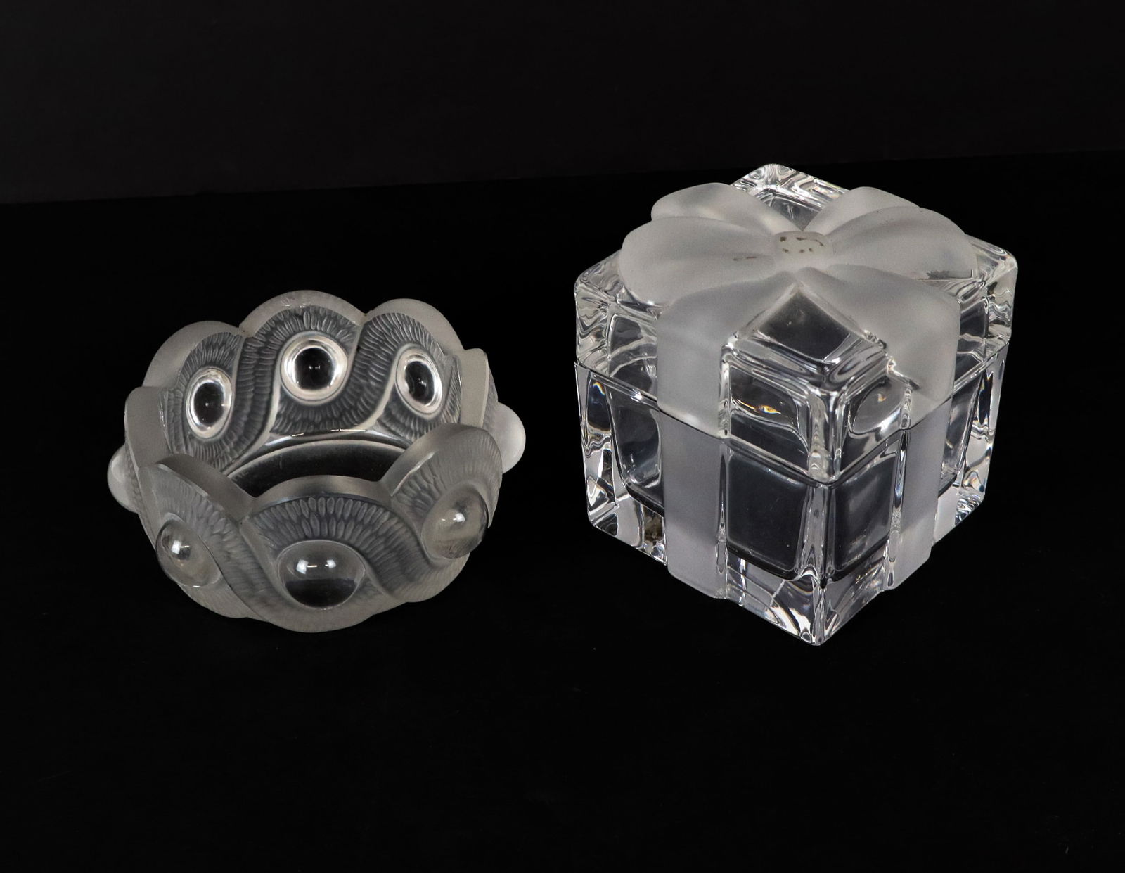 Lalique and Tiffany Glass Accessories, 2: Two glass accessories, comprising a Lalique "Gao" candy / trinket dish [2" H x 3.5" Diameter], together with a Tiffany & Co. trinket box with frosted bow [3.5" H x 3" Square], marks to base. Overall c