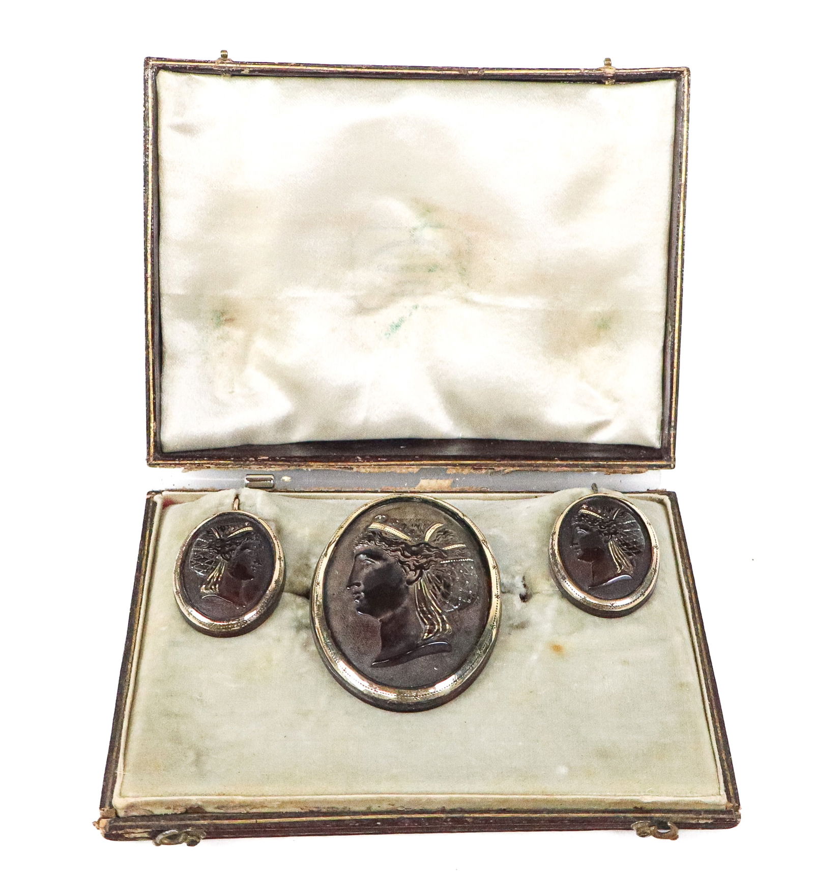 Victorian Faux Tortoiseshell Cameo Pin & Earrings: Victorian faux tortoiseshell and faux pique cameo brooch and earring set, last quarter of the 19th century, mounted with yellow metal, now in a fitted box. Overall condition is fair, with losses.