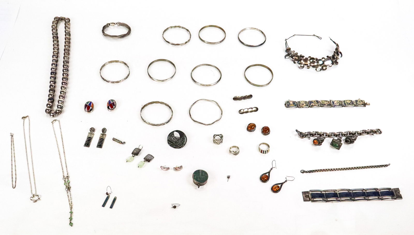 Group of Sterling and Other silver Jewelry, 40+: Group of assorted sterling and other jewelry, comprising 9 bangle bracelets, box chain link bracelet, sodalite inlaid bracelet, azuramalachite inlaid bracelet, woven braid bracelet, Egyptian silver ch