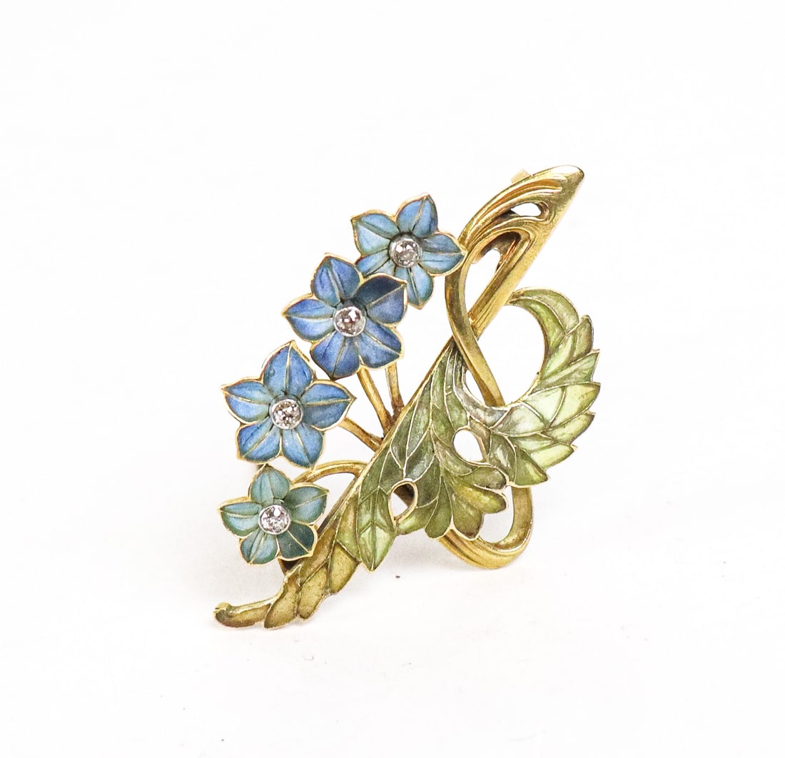 Art Nouveau Plique a Jour Enamel Brooch: Art Nouveau plique a jour enamel and gold brooch, French, possibly by Louis Aucoc, of landscape form, depicting a row of blooming blue enamel flowers with diamond pistils, the green foliage gently swe