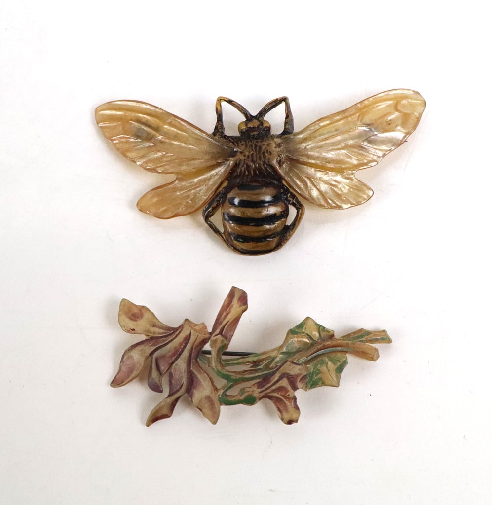 Georges Pierre Art Nouveau Carved Horn Bee Brooch,: Georges Pierre art nouveau carved and painted horn bee brooch, French, 1895-1905, signed GIP, together with another carved horn foliage brooch, possibly by Georges Pierre. [Bee: 2" H x 3.5" W, Foliage