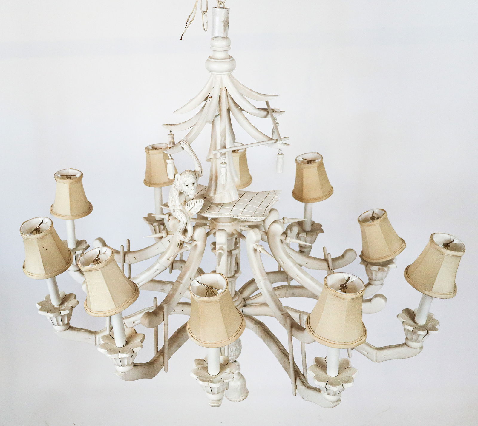 Chinoiserie Carved and Painted Wood Chandelier: Chinoiserie carved and painted wood chandelier, 20th century, with a monkey to upper, and bamboo form girandole arms, and ten lights. [Less chain: 39" H x 36" Diameter]. Condition is good; wiring unte