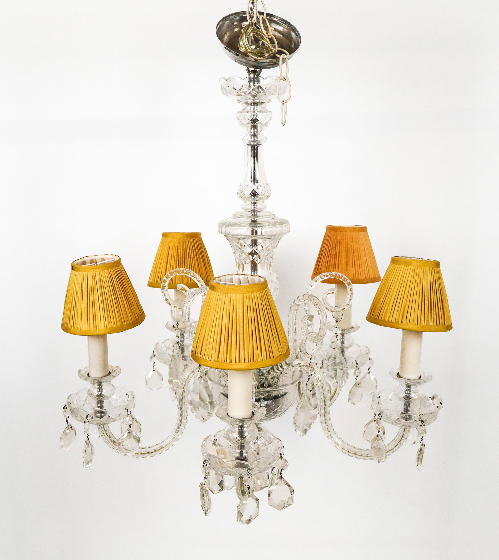 Etched and Cut Crystal Five-Light Chandelier: Etched and cut crystal five-light chandelier, 20th century, with an etched crystal stem and five etched girandole arms, with faceted crystal lustres. [30" H x 25" Diameter]. Condition is good with som