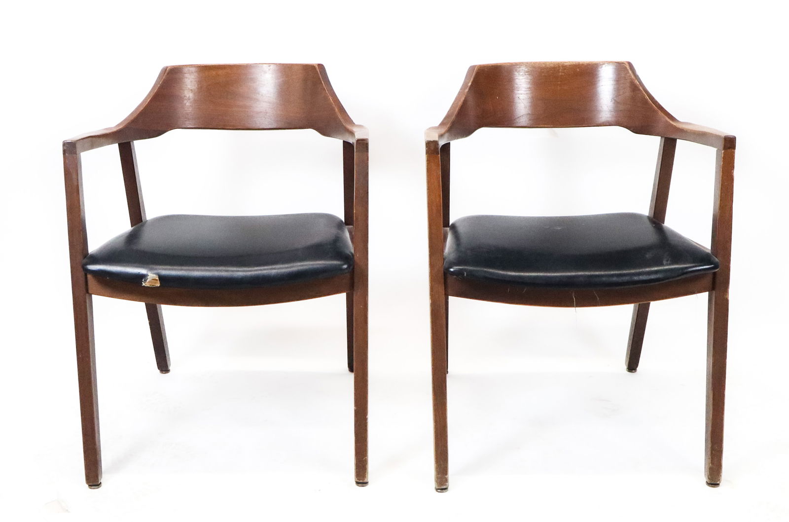 Jasper Chair Co. Pair of Modern Walnut Armchairs: Pair of modern walnut armchairs with vinyl seats, by Jasper Chair company. [30" H x 23" x 23"]. Need tightening, tear to seat.