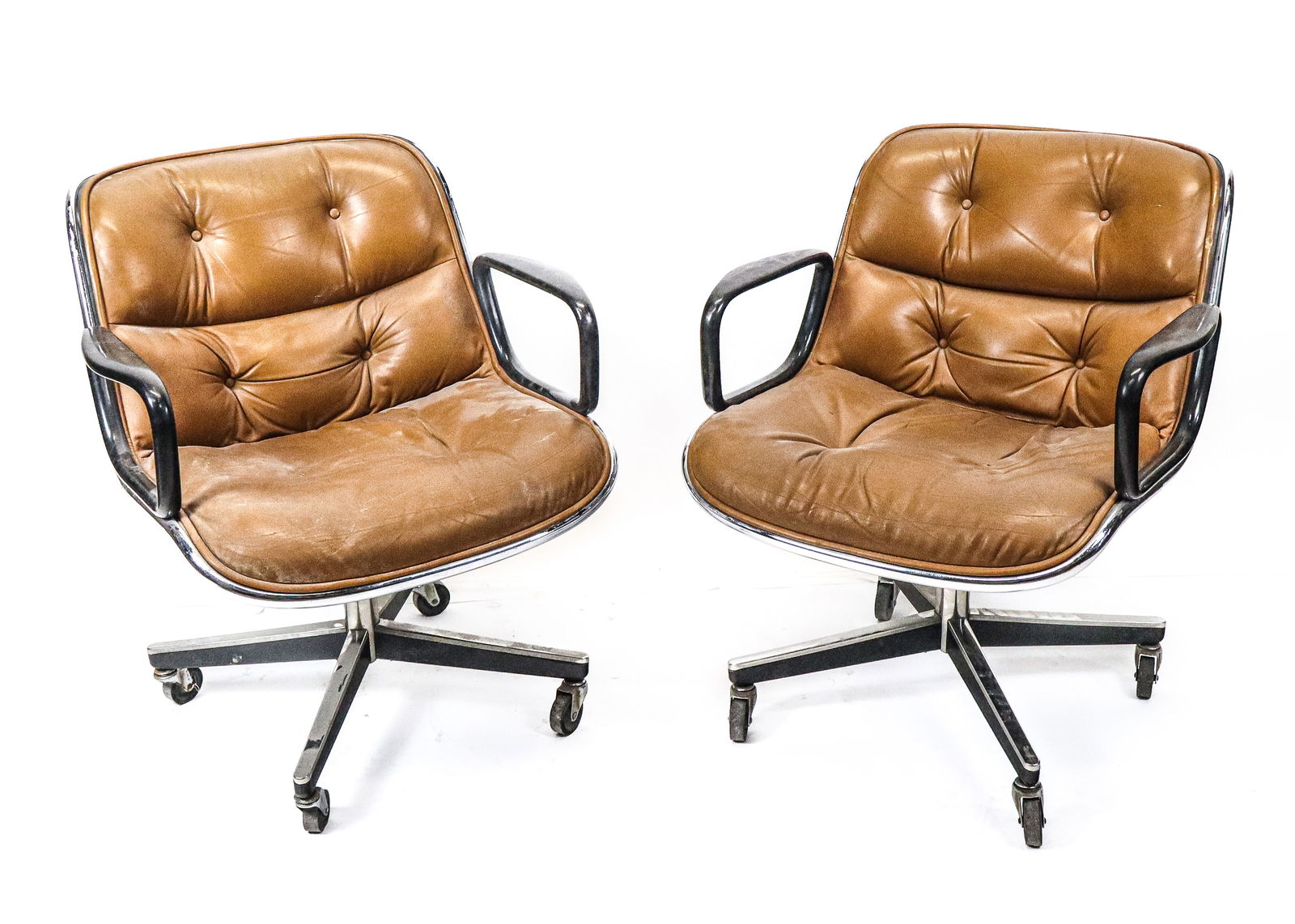 Charles Pollock for Knoll Brown Office Chairs - 2: Charles Pollock for Knoll office chairs, 2 in Brown Leather, black painted arms on chrome, on wheels. [31" H x 26" W x 28" D]. Fair condition, scuffs and pitting to chrome, wear to leather, missing bu