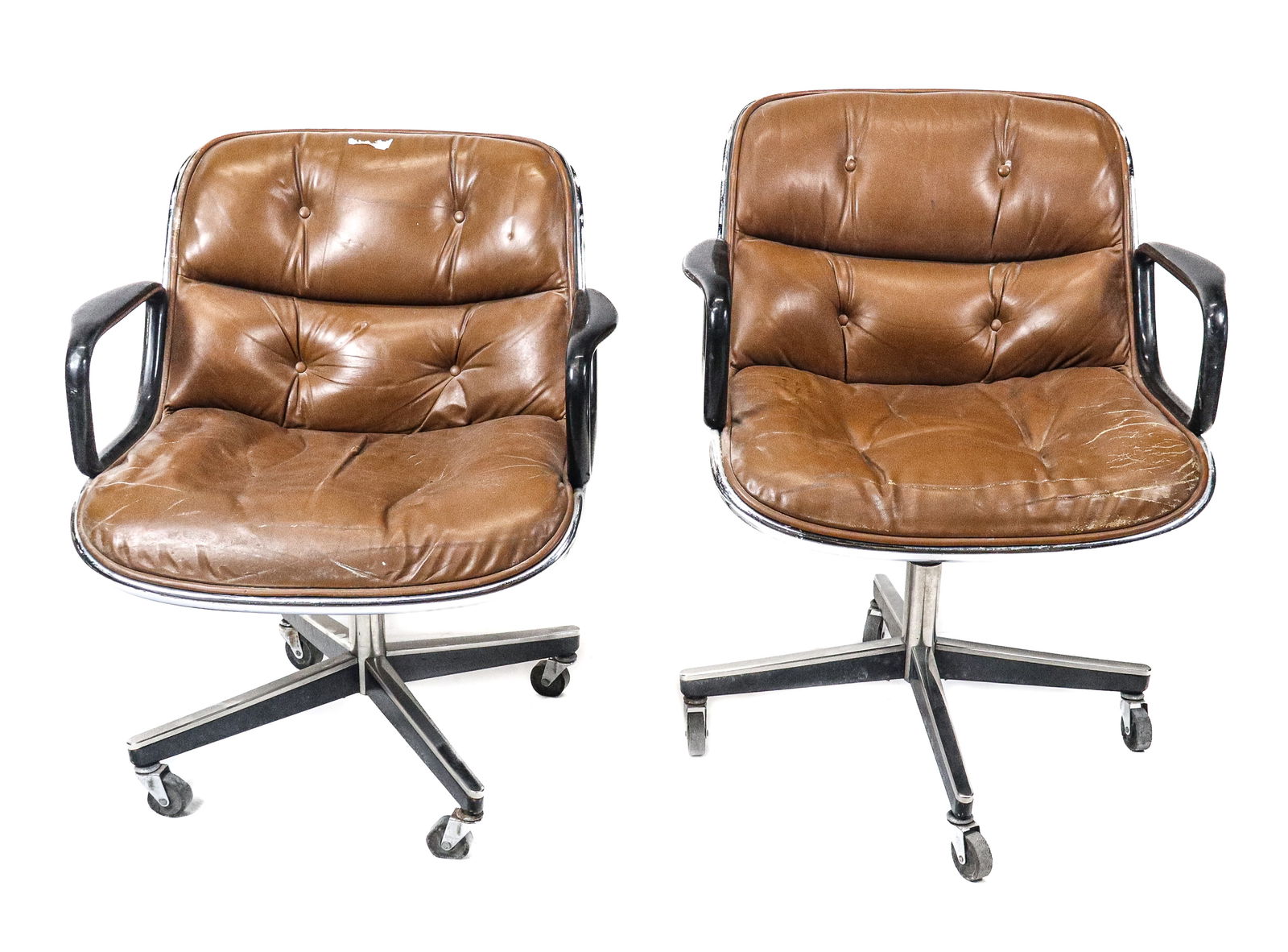 Charles Pollock for Knoll Brown Office Chairs - 2: Charles Pollock for Knoll Brown office chairs, 2 in brown leather, black painted arms on chrome, on wheels. [31" H x 26" W x 28" D]. Poor condition, buttons missing, wear to leather, scuffs and pittin