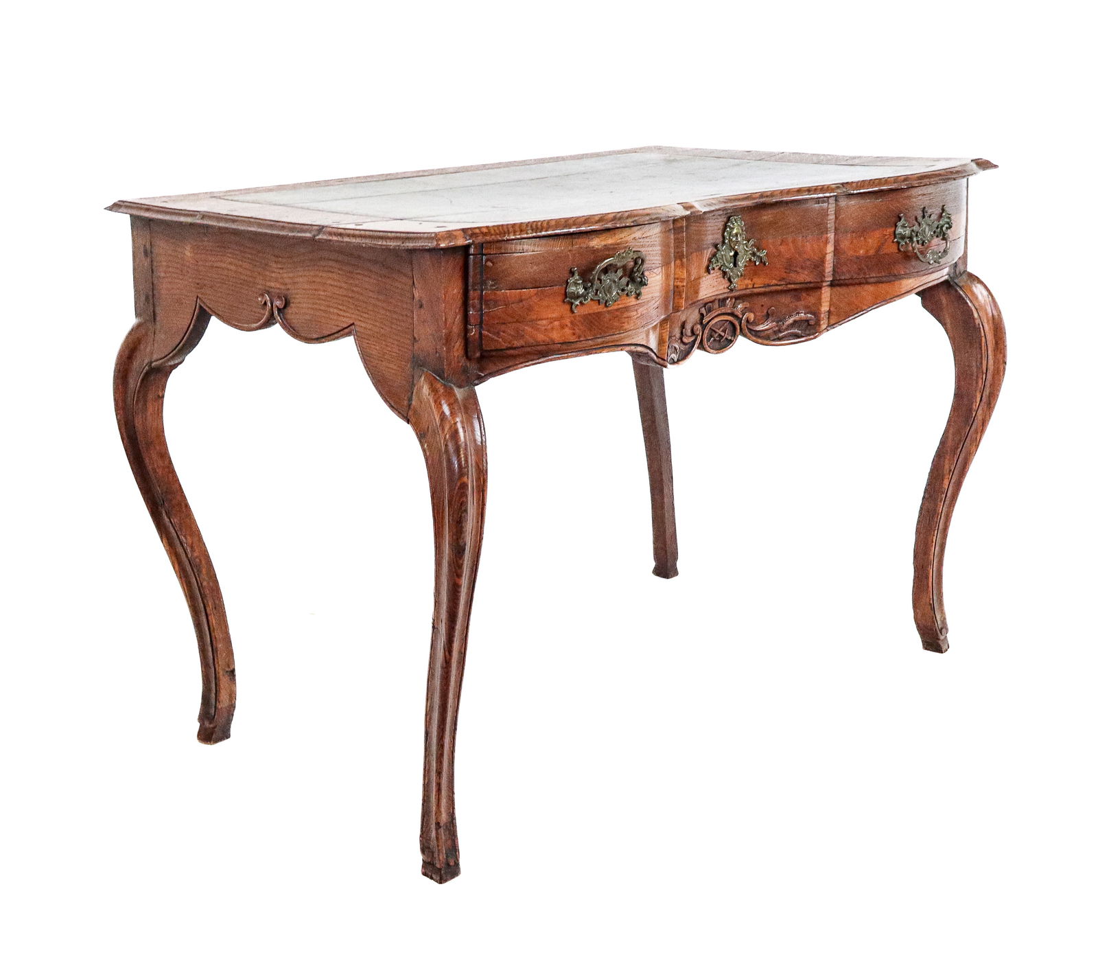 Louis XV Provincial Desk: Louis XV provincial desk, 19th century, with a tooled leather top, single drawer, and four cabriole legs, decorative brass mounts, and carved apron. [31" H x 43" W x 29" D]. Condition is good with age