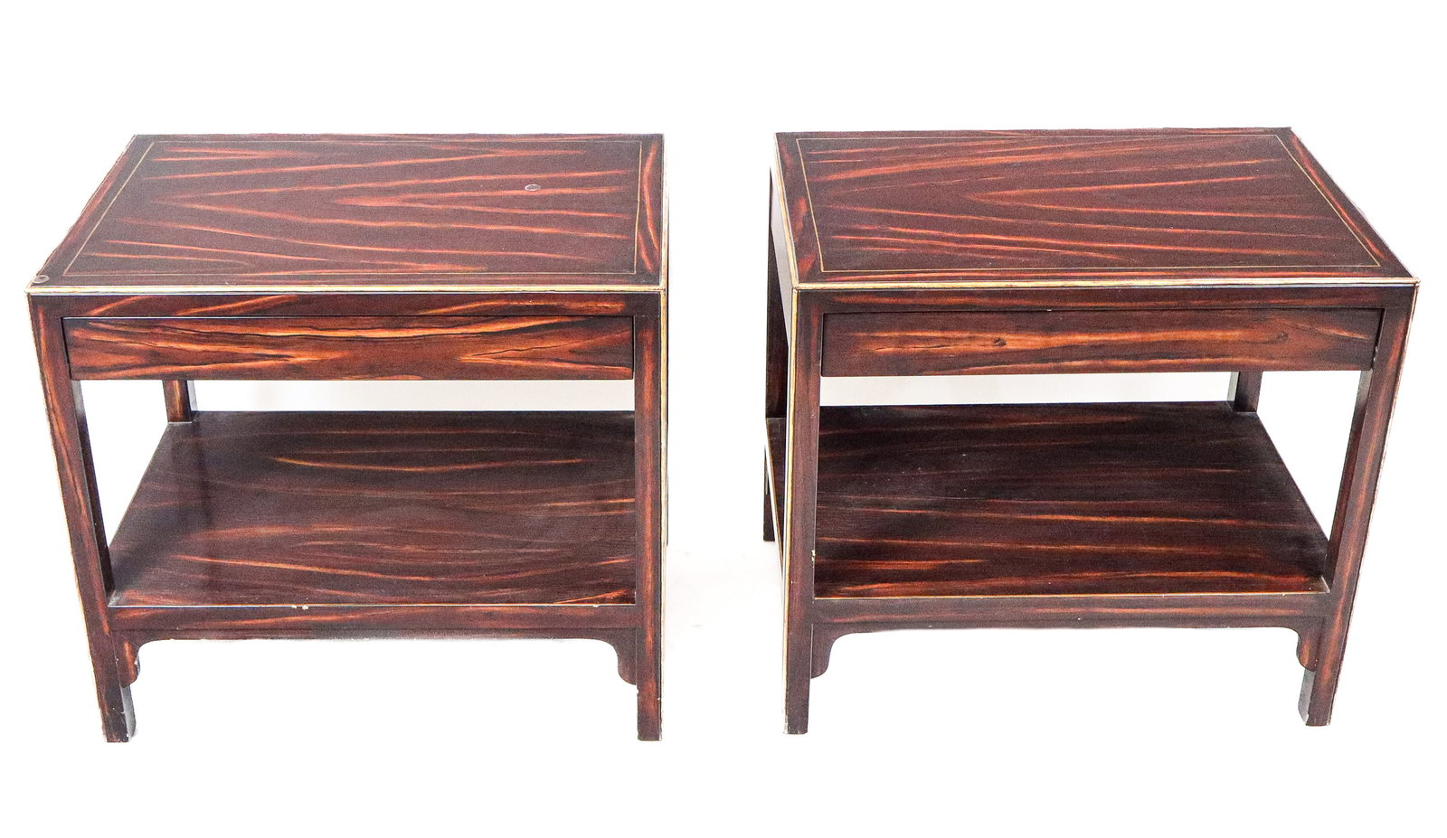 Pair of Mid-Century Modern Two-Tier Lamp Tables: Pair Mid-Century Modern large two-tier lamp tables, with a gilt edging along painted grained medium wood bodies, each having one drawer. [27.5" H x 30" x 20"]. Good condition, some crackling to finish