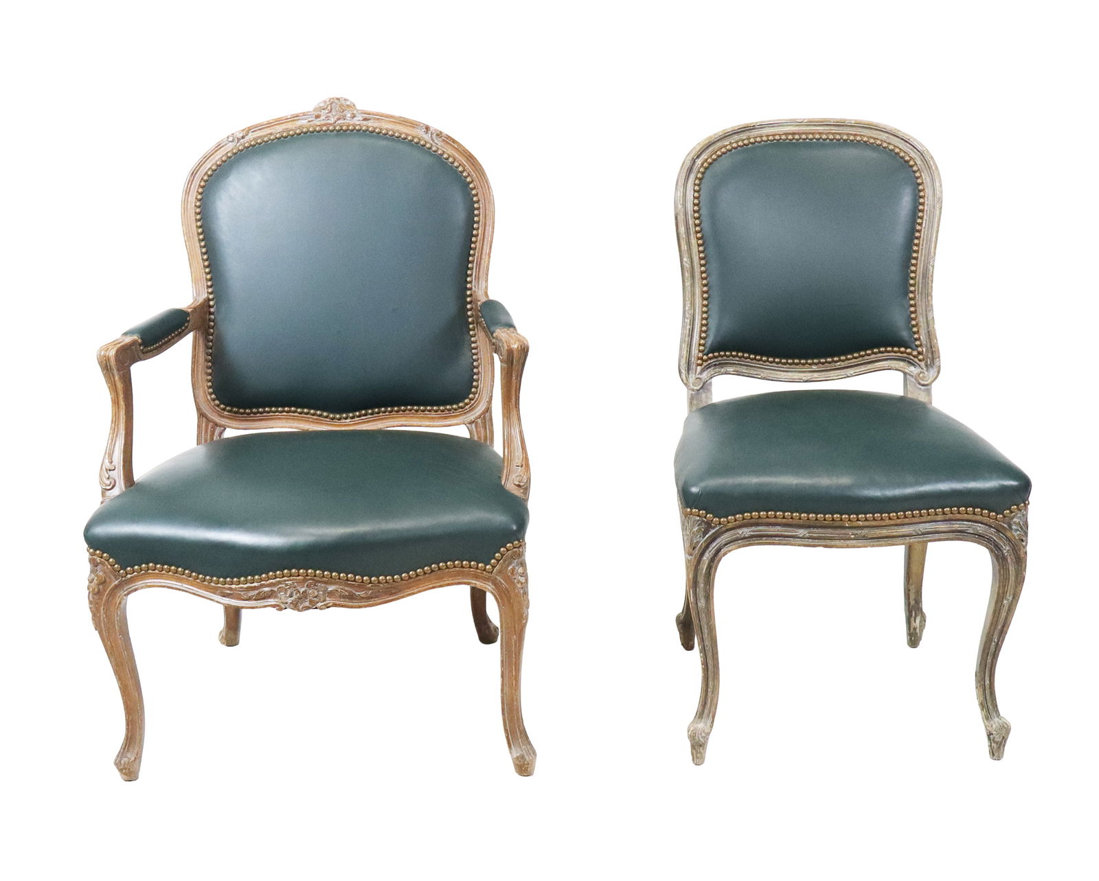 Carved Chairs, 2: Two carved chairs, French, one armchair with all over carved frame, and one similar side chair, both with studded trim on green leather. [Armchair 38" x 26" x 25"] Both in good condition.
