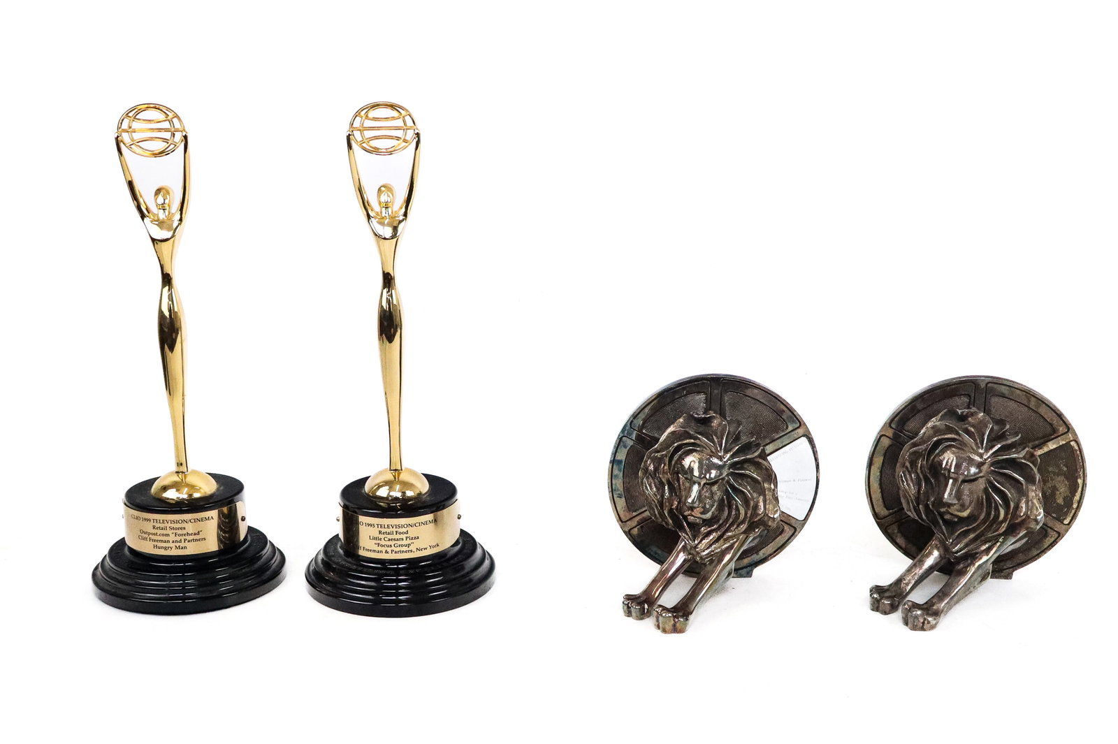 Two Pairs of Advertising Awards: Two pairs of advertising awards, comprising one pair "CLIO"s awarded to Cliff Freeman and Partners for "Hungry Man" and "Focus Group" for Little Caesars. One Pair Arthus-Bertrand Silver Plated Bookend