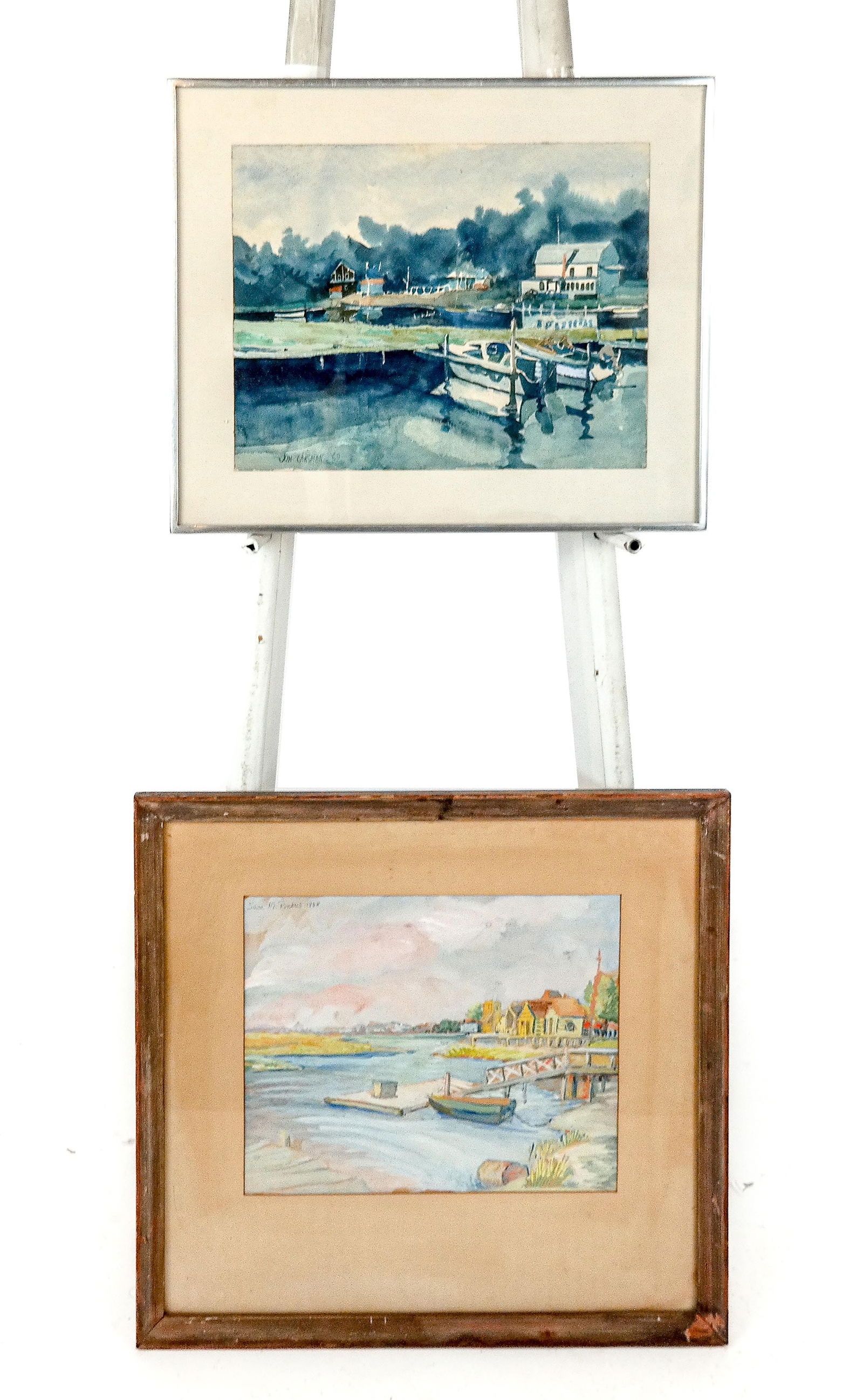Jon CARSMAN & 1 Other, 2 Watercolor Harbor Scenes: Jon Carsman (American, 1944-1987) watercolor in cool tones depicting a harbor scene with docked boats and houses, signed and dated lower left "Jon Carsman," 1969, bearing labels to verso for The Museu