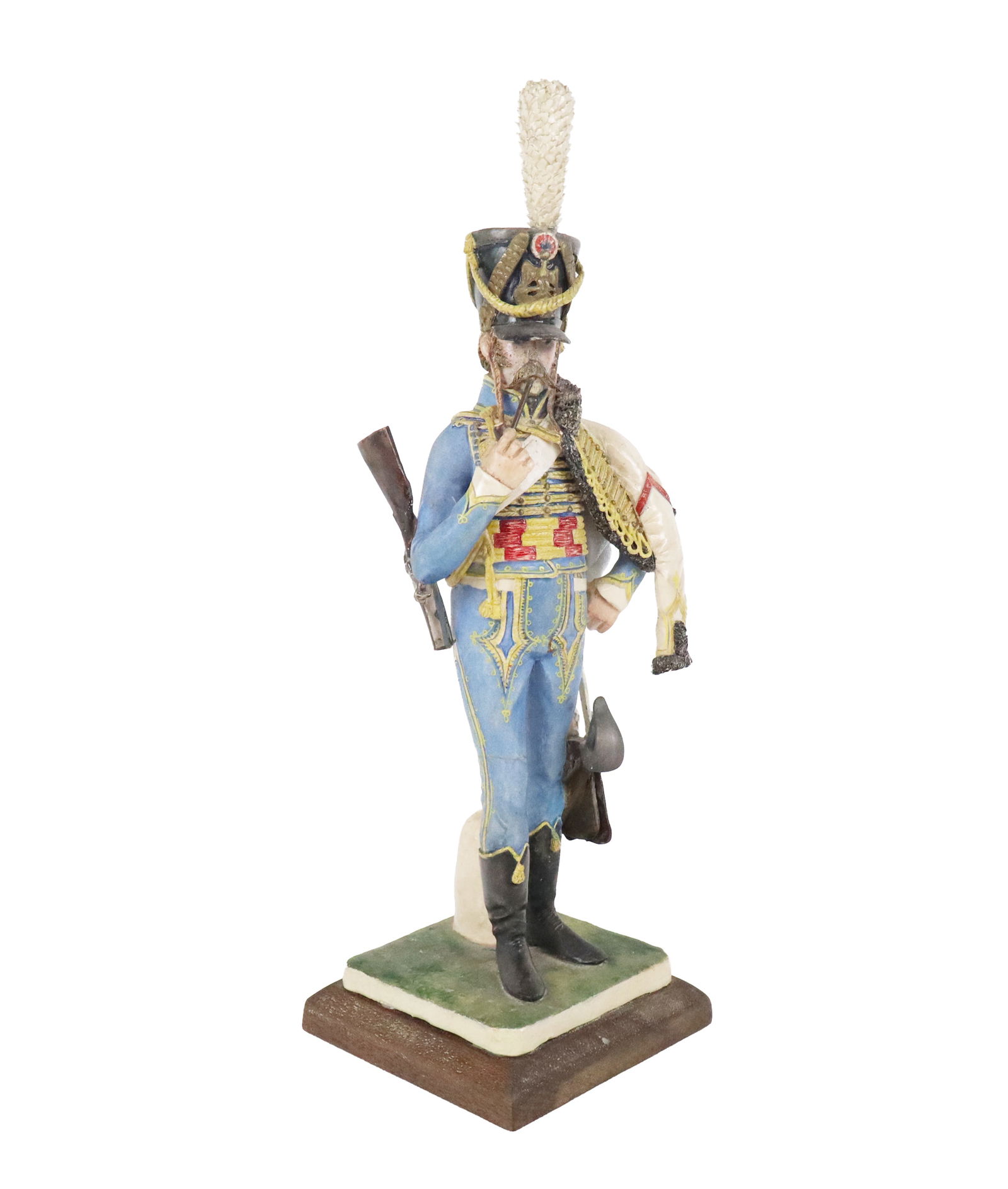 Bernard BELLUC Porcelain of a French Hussard: Bernard Belluc (French, b. 1949) porcelain figure of a soldier from the 5th French Hussars, on an affixed wood stand, signed Belluc to reverse. [12.5" H x 4" Square]. Condition is good with a loss to