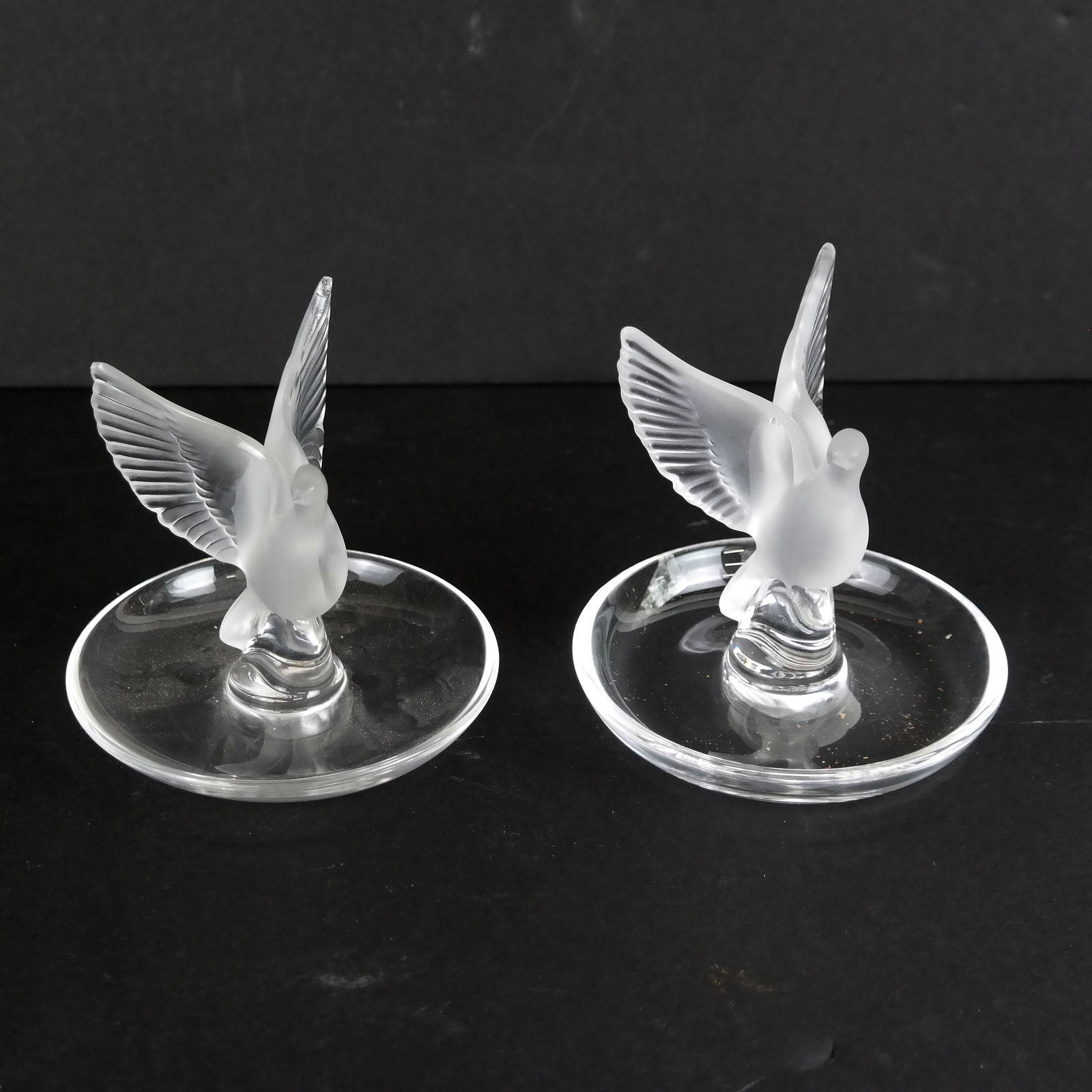 Pair of Lalique France Dove Dishes: Pair of Lalique France dove dishes. [3" H x 3 3/4" Diam. (bases)]. Both in good condition. In Jewelry Case
