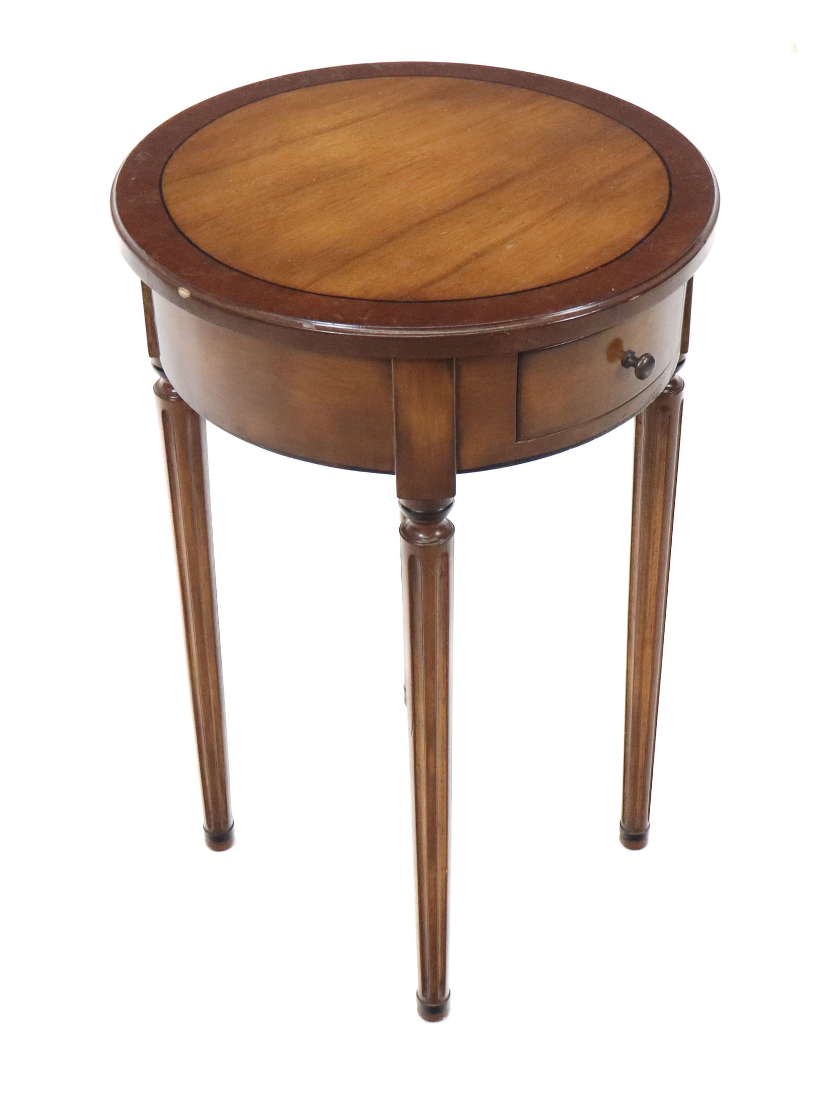 Small Round French Stand: Small round French stand with drawer on both sides, cross banded top, fluted legs. [27" X 17" diameter]. Good condition